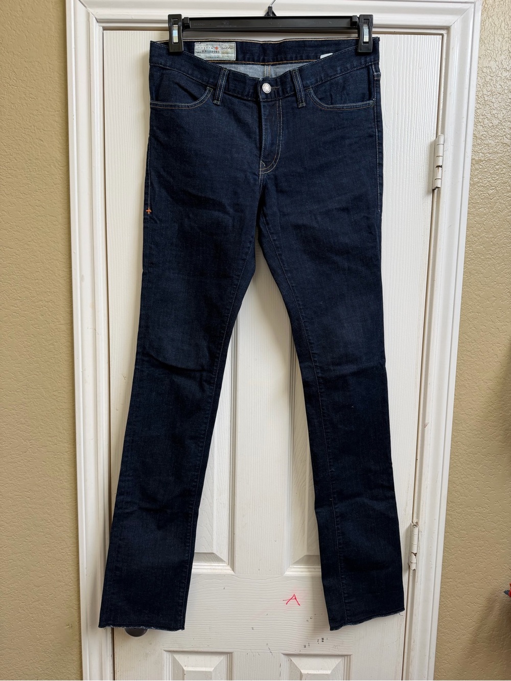 imogene + willie indigo jeans with gold stitching and orange logo